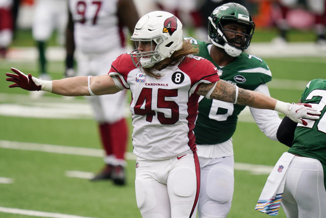 Arizona Cardinals linebacker Dennis Gardeck, top, sacks Denver