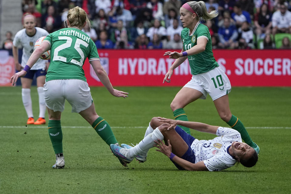 United States forward Mallory Swanson (9) goes down with an injury during the first half of an international friendly soccer match against Ireland in Austin, Texas, Saturday, April 8, 2023. (AP Photo/Eric Gay)