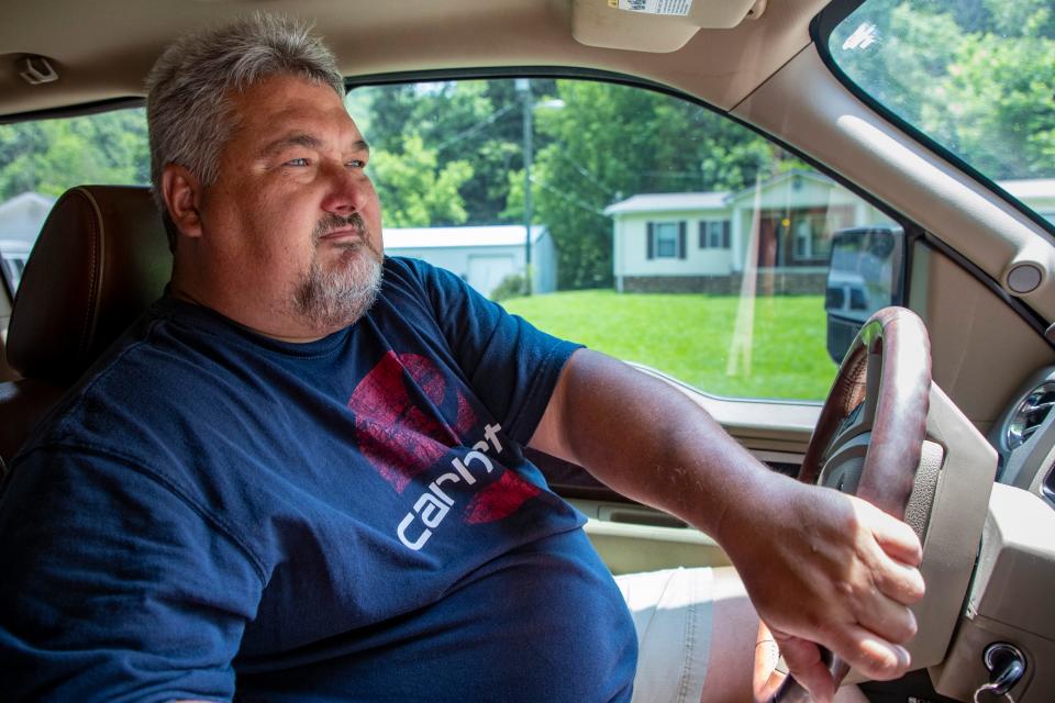 Tracy Neece drives to his property that has been strip mined in Floyd County, Kentucky. July 15, 2021