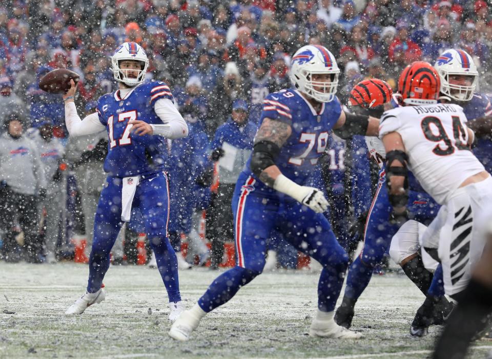 Bills quarterback Josh Allen looks for an open receiver against the Bengals in their playoff game at Orchard Park.