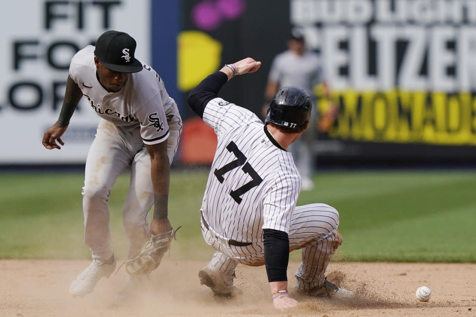 Chicago White Sox shortstop Tim Anderson (7) loses the ball as New York Yankees Clint Frazier (77) steals second during the ninth inning of a baseball game, Sunday, May 23, 2021, at Yankee Stadium in New York. Frazier scored the winning run when Chicago White Sox relief pitcher Liam Hendriks walked the Yankees Aaron Judge with the bases loaded. . (AP Photo/Kathy Willens)