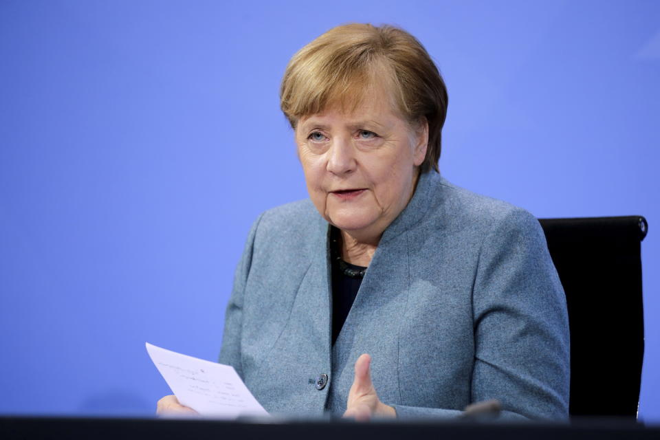 German Chancellor Angela Merkel holds a news conference after meeting with vaccine producers and Germany's state prime ministers via video conference, in Berlin, Germany, Monday Feb. 1, 2021. (Hannibal Hanschke/Pool via AP)