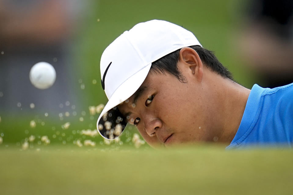 Tom Kim, of South Korea, hits from the bunker on the first hole during the third round of the PGA Championship golf tournament at the Valhalla Golf Club, Saturday, May 18, 2024, in Louisville, Ky. (AP Photo/Sue Ogrocki)