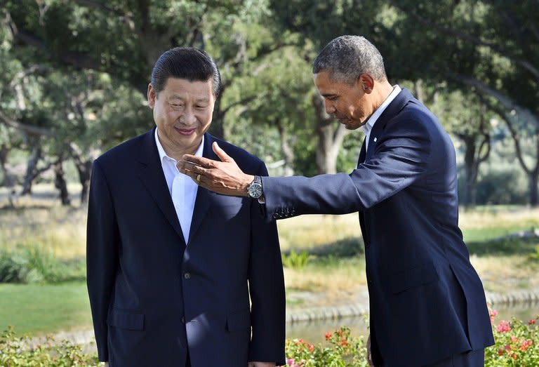 US President Barack Obama and Chinese President Xi Jinping head for their bilateral meeting at the Annenberg Retreat at Sunnylands in Rancho Mirage, California, on June 7, 2013. Obama and Xi ended their first US-China summit Saturday, forging a rapport and policy understandings, if not breakthroughs, on North Korea, climate and cyber issues