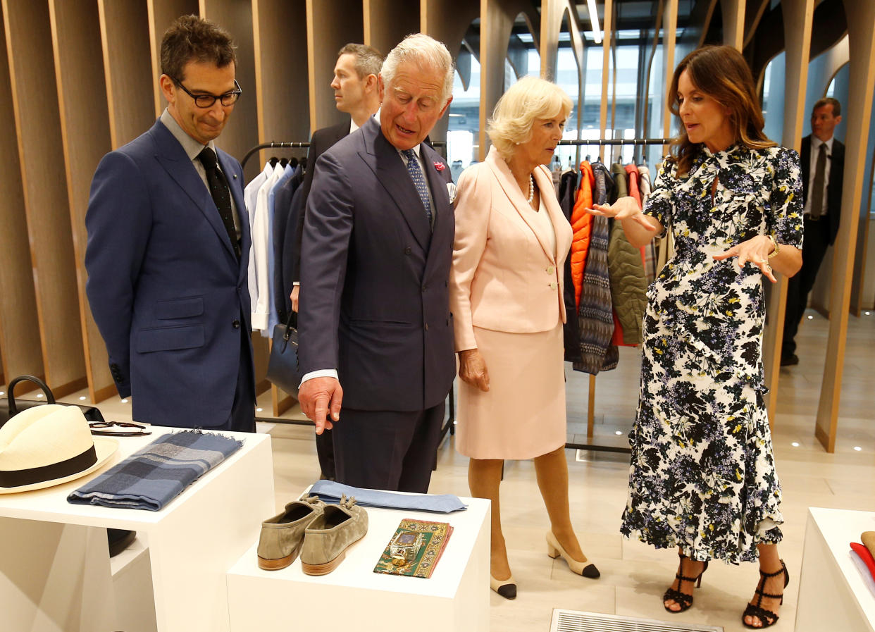 LONDON, ENGLAND - MAY 16:  Camilla, Duchess of Cornwall and Prince Charles, Prince of Wales tour the new Tech Hub, with British Fashion Council Chief Executive Caroline Rush and Chief Executive of Yoox Net-a-Porter Group Federico Marchetti at the Yoox Net-a-Porter Group offices on May 16, 2018 in London England. (Photo by Henry Nicholls - WPA Pool/Getty Images)