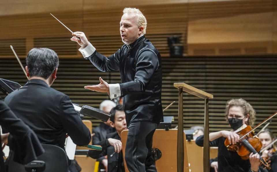 Metropolitan Opera's new music director Yannick Nézet-Séguin, center, debut as conductor of the New York Philharmonic, performing Leonard Bernstein's music from Bradley Cooper's movie "Maestro," Wednesday, Feb. 14, 2024, in New York. (AP Photo/Bebeto Matthews)