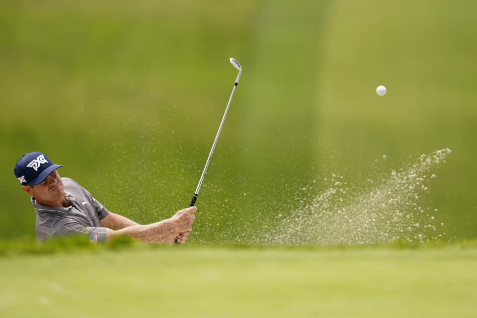 Kyle Westmoreland hits out of a bunker on the 13th hole during a practice round of the U.S. Open Golf Championship, Monday, June 14, 2021, at Torrey Pines Golf Course in San Diego. (AP Photo/Gregory Bull)