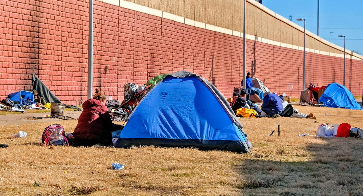 Homeless tents are set up Dec. 11 along the retaining wall of Oklahoma City Boulevard just east of where Classen Boulevard goes under it.