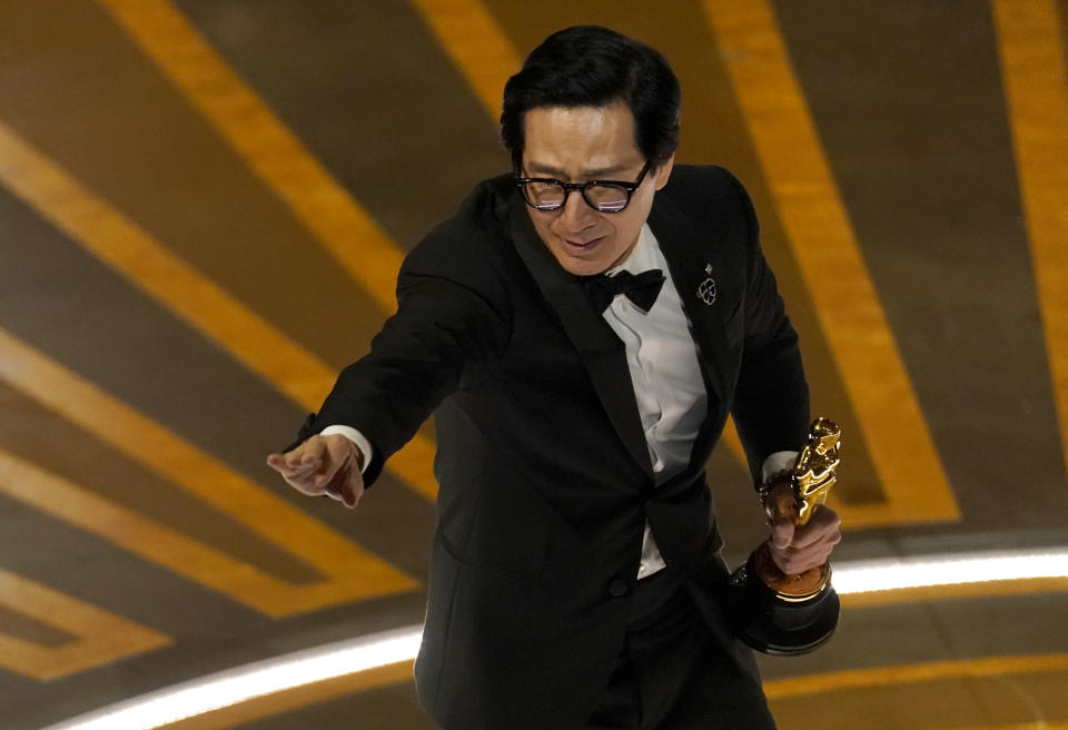 Ke Huy Quan accepts the award for best performance by an actor in a supporting role for "Everything Everywhere All at Once" at the Oscars on Sunday, March 12, 2023, at the Dolby Theatre in Los Angeles. (AP Photo/Chris Pizzello)