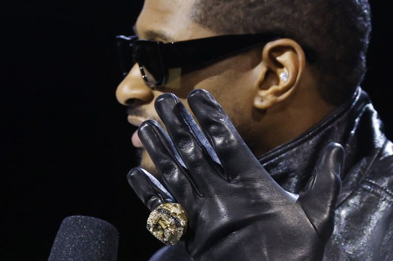 Super Bowl halftime show performer Usher shows off a custom Super Bowl ring at a news conference Thursday at the Mandalay Bay Convention Center in Las Vegas. Photo by John Angelillo/UPI