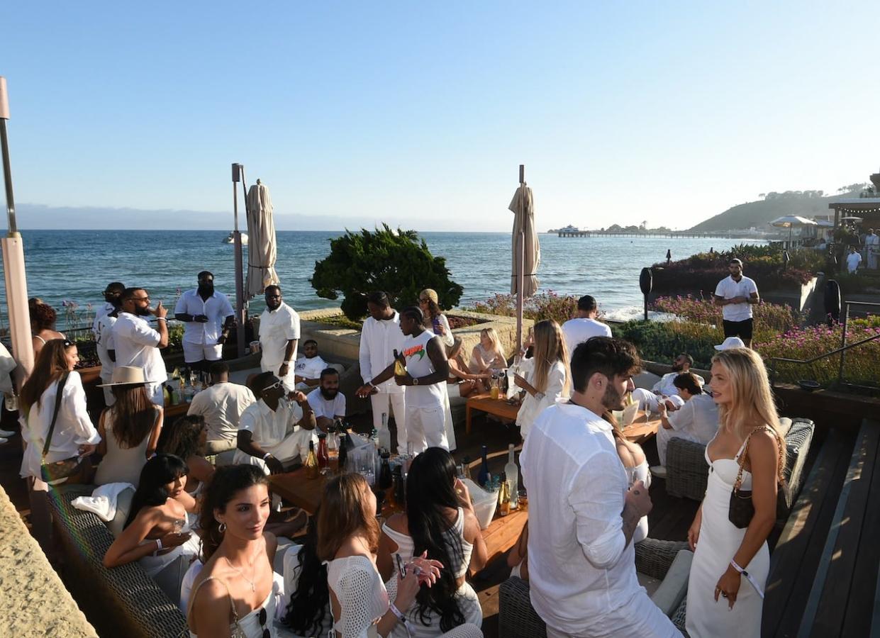 A general view of the ocean and guests wearing white at the July 4 party at Nobu Malibu in California.