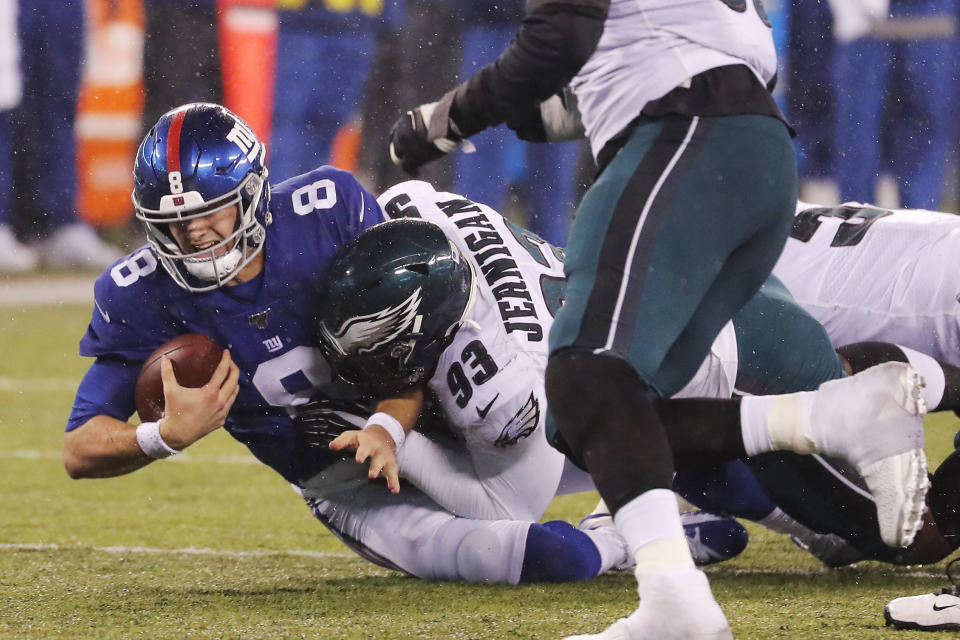 New York Giants quarterback Daniel Jones (8) is sacked by Philadelphia Eagles defensive tackle Timmy Jernigan (93) in the second half of an NFL football game, Sunday, Dec. 29, 2019, in East Rutherford, N.J. (AP Photo/Seth Wenig)