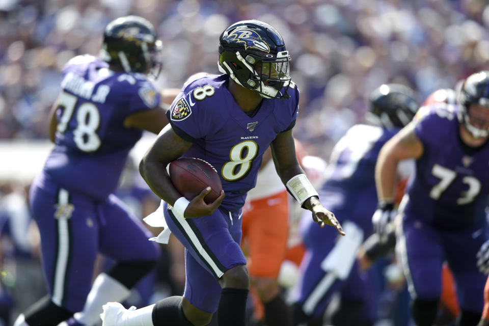 Baltimore Ravens quarterback Lamar Jackson runs with the ball against the Cleveland Browns during the first half of an NFL football game Sunday, Sept. 29, 2019, in Baltimore. (AP Photo/Gail Burton)