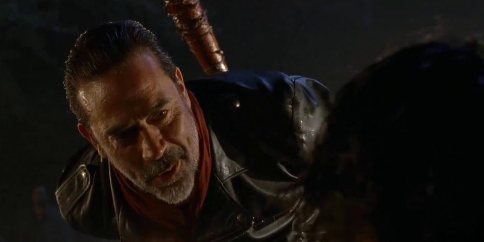 Negan looking down at one of his potential victims