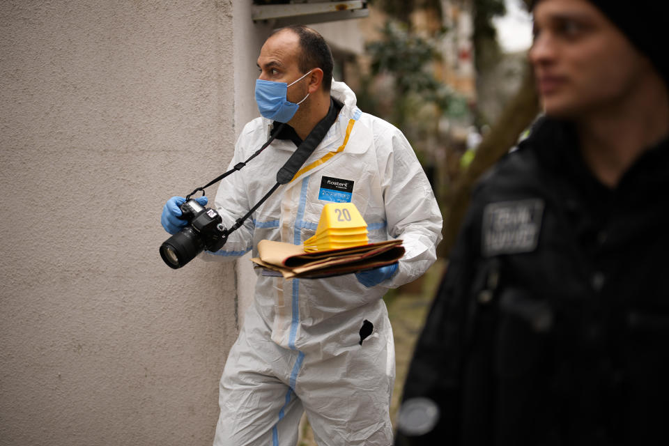 A Turkish Police forensic officer works near to Santa Maria church in Istanbul, Turkey, Sunday, Jan. 28, 2024. Two masked assailants attacked a church in Istanbul during Sunday services, killing one person, Turkish officials said. (AP Photo/Emrah Gurel)