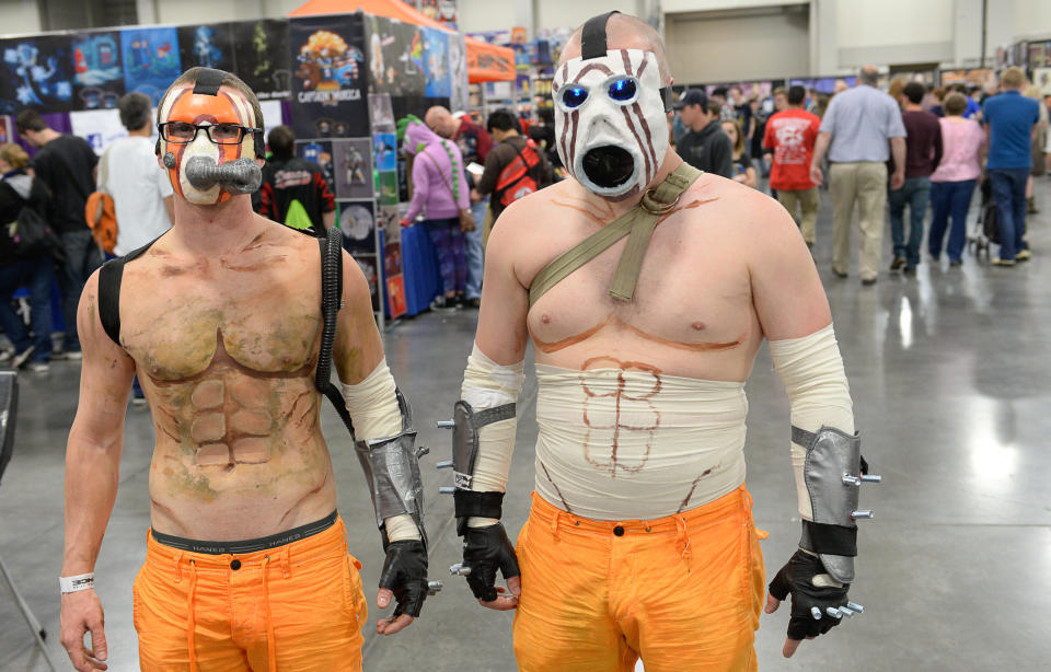 "Psychos from Borderlands," Zac Keyes, left, and his brother Daniel, join in the fun as thousands of fiction fans from near and far gather at the Salt Palace Convention Center in Salt lake City, Utah, Friday, April 18, 2014, for day two of Salt Lake Comic Con's FanX. (AP Photo/The Salt Lake Tribune, Francisco Kjolseth)