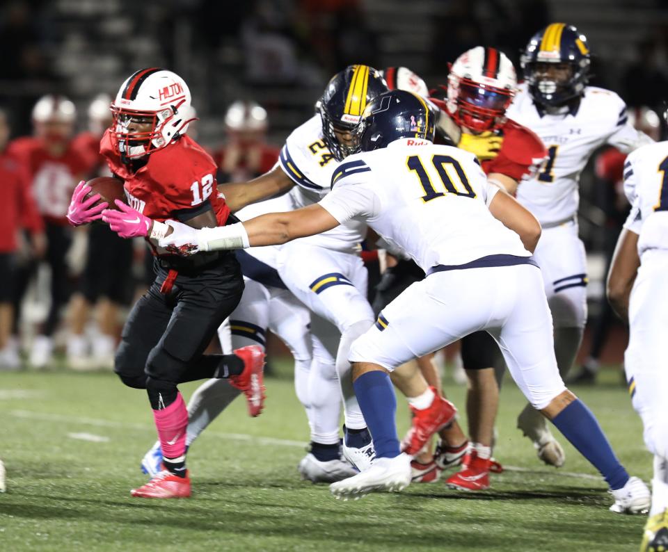 Hilton's Robert Lowry avoids UPrep's Karmari Miller and Alex Laboy.