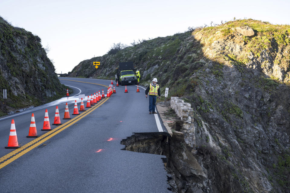 Roger Morris, an assistant resident engineer with MNS Engineers, assesses a break in the southbound lane of Highway 1 at Rocky Creek Bridge in Big Sur, Calif., Monday, April 1, 2024, following an Easter weekend storm. (AP Photo/Nic Coury)