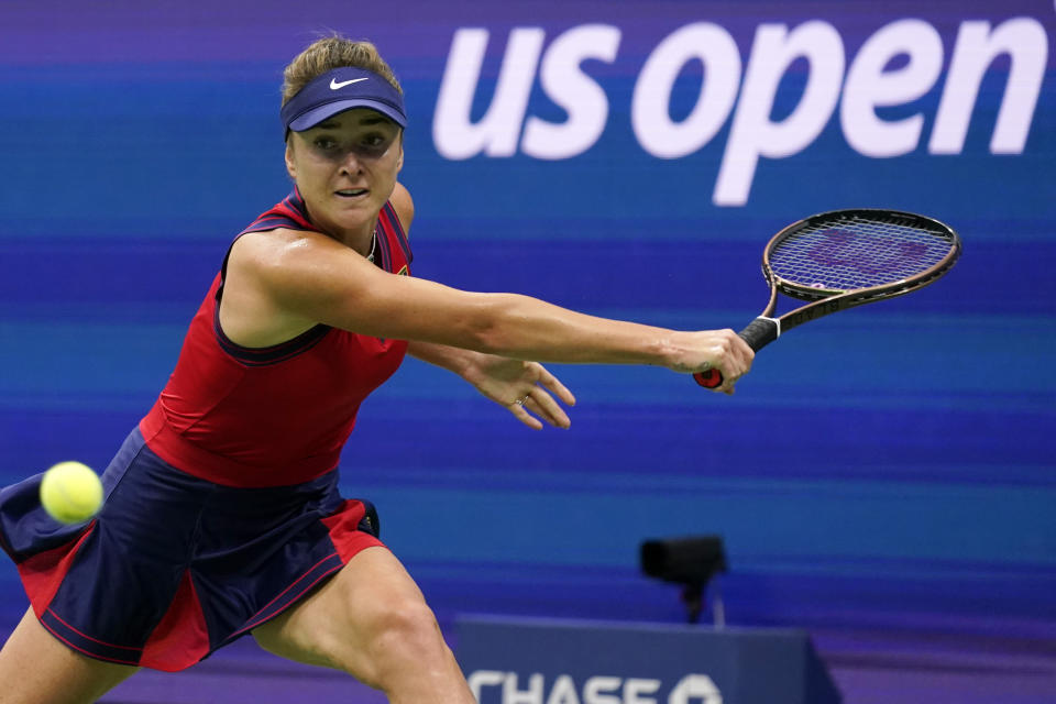 Elina Svitolina, of Ukraine, returns to Simona Halep, of Romania, during the fourth round of the US Open tennis championships, Sunday, Sept. 5, 2021, in New York. (AP Photo/Seth Wenig)