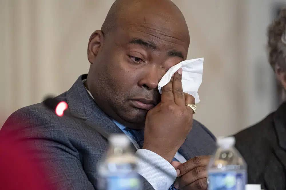 Democratic National Committee chair Jaime Harrison cries while listening to committee member Donna Brazile talk about the importance of proposed changes to the primary system during a DNC Rules and Bylaws Committee meeting to discuss President Joe Biden’s presidential primary lineup at the Omni Shoreham Hotel on Friday, Dec. 2, 2022, in Washington. (AP Photo/Nathan Howard)