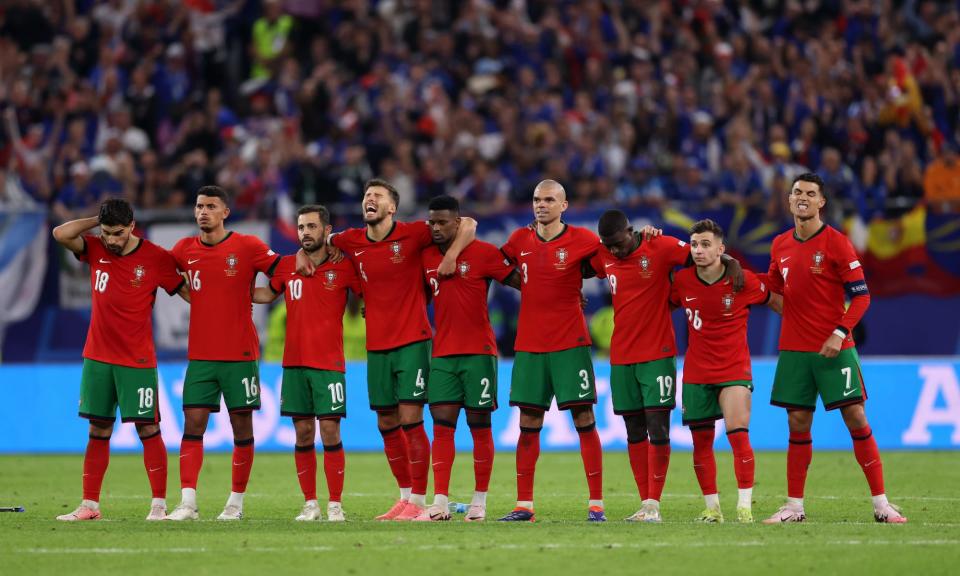 <span>Portugal’s players react as João Félix misses from the spot.</span><span>Photograph: Lars Baron/Getty Images</span>