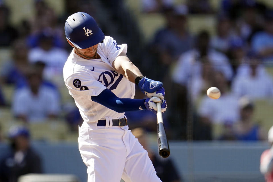 FILE - Los Angeles Dodgers' Trea Turner connects for a three-run home run during the fifth inning of a baseball game against the Colorado Rockies, Oct. 5, 2022, in Los Angeles. Turner and the Philadelphia Phillies visit Freddie Freeman and Los Angeles for a matchup of NL contenders. Turner played for the Dodgers last year, batting .298 with 21 homers and a career-high 100 RBIs. (AP Photo/Marcio Jose Sanchez, File)