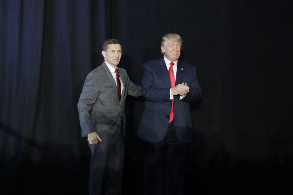 FILE - Retired Lt. Gen. Michael Flynn, left, introduces Republican presidential candidate Donald Trump at a campaign rally on Sept. 29, 2016, in Bedford, N.H. Flynn became a chief promoter of the so-called “Stop the Steal” effort and championed bogus claims about foreign interference and ballot tampering that weren’t supported by credible evidence. (AP Photo/John Locher, File)