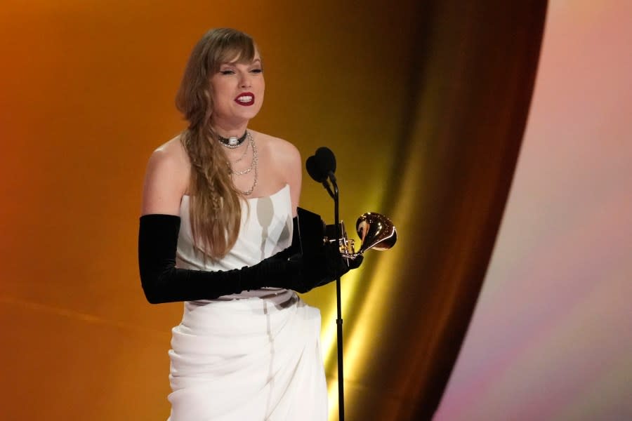 Taylor Swift accepts the award for best pop vocal album for “Midnights” during the 66th annual Grammy Awards on Sunday, Feb. 4, 2024, in Los Angeles. (AP Photo/Chris Pizzello)