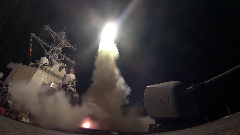 The guided-missile destroyer USS Porter launches a tomahawk land attack missile as the United States blasted a Syrian air base.