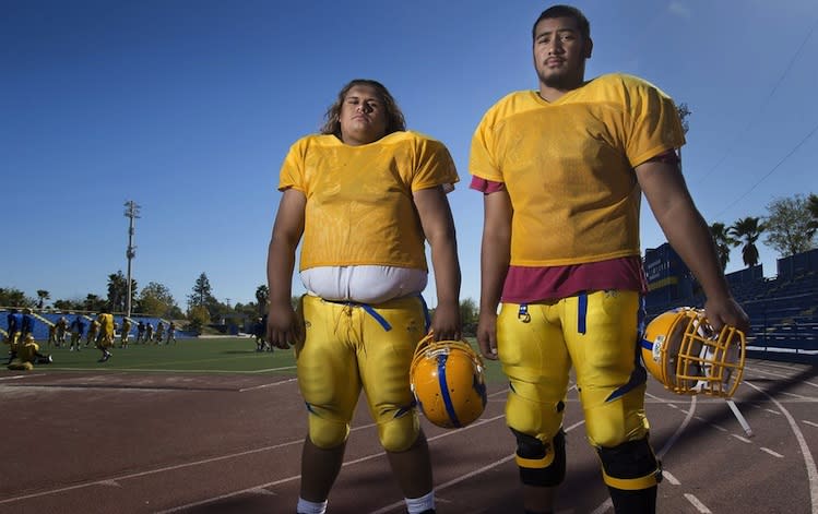 Sacramento (Calif.) Grant High offensive linemen Shawn Matautia (left) and Darrin Paulo weigh a combined 720 pounds -- Sacramento Bee