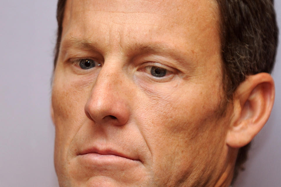 This photo taken on February 28, 2011 shows then seven-time Tour de France winner Lance Armstrong attending a press conference in Los Angeles to announce he will serve as co-chair for a campaign seeking to raise more than 600 million USD annually for cancer research in California. - Lance Armstrong has agreed to pay $5 million in order to settle his looming federal fraud case stemming from his use of performance-enhancing drugs during the Tour de France, US media reported on April 19, 2018. The former cycling superstar was due to face a trial next month over claims that he defrauded the US government when he doped while racing for his United States Postal Service-sponsored team. (Photo by Gabriel BOUYS / AFP)        (Photo credit should read GABRIEL BOUYS/AFP via Getty Images)