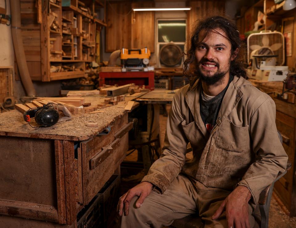 Reeve Carter, 22, creates intricate cutting boards and bowls from wood in the shop in his family home.