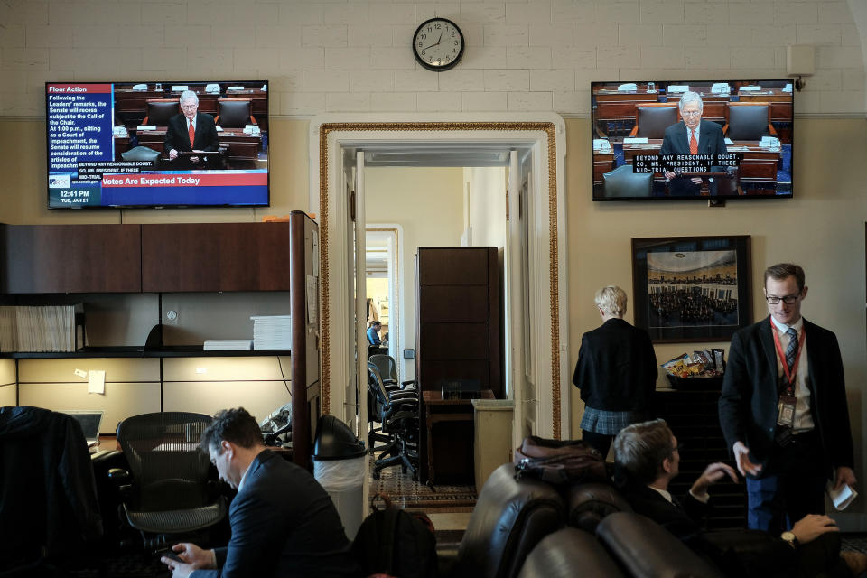 Reporters watch the senate impeachment trial begin in the press gallery off the senate floor at the Capitol in Washington, D.C. on Jan. 21, 2020. | Gabriella Demczuk for TIME