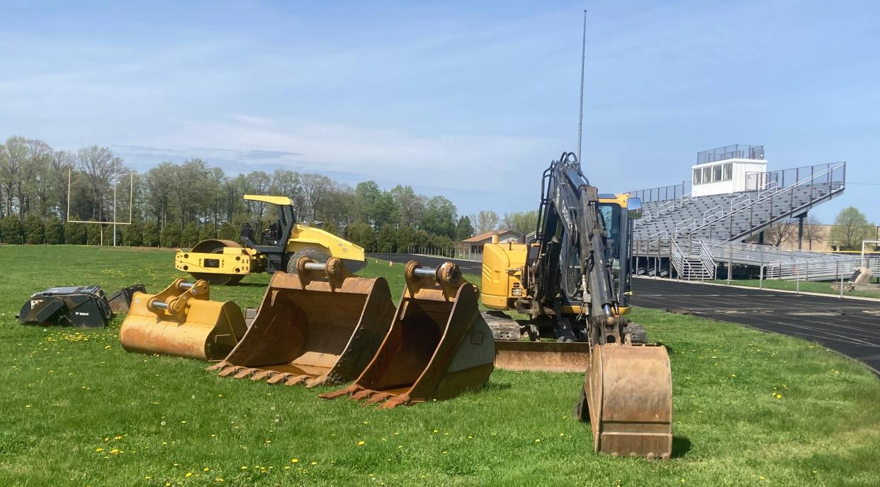 A backhoe and steamroller sit idle within North East's Ted Miller Stadium on Monday. The facility is in the early stages of a $3.5 million project to have field turf installed in time for the Grapepickers' 2024 football season. The construction will force North East's annual track and field meet to be held this Saturday at Harbor Creek.