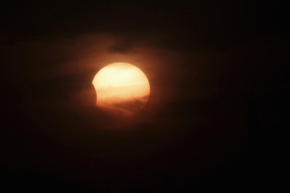 A partially-eclipsed sun is seen in Amman