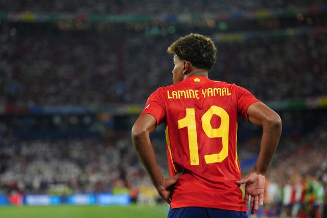 Lamine Yamal with his back to the camera, with 'Lamine Yamal 19' on the rear of his shirt, during Spain's Euro 2024 semi-final against France