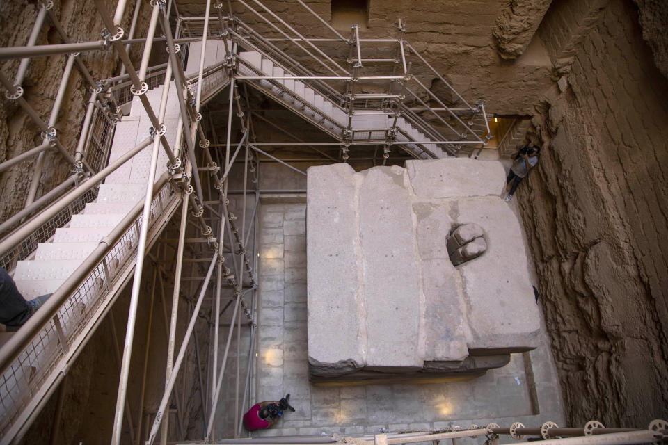 Journalists film the southern cemetery of King Djoser, after its restoration, near the famed Step Pyramid, in Saqqara, south of Cairo, Egypt, Tuesday, Sept. 14, 2021. (AP Photo/Nariman El-Mofty)