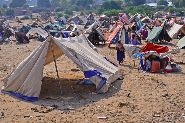 Internally displaced flood-affected people take refuge at a makeshift camp in Dadu district of Sindh province on Wednesday. (Photo: AFP via Getty Images))