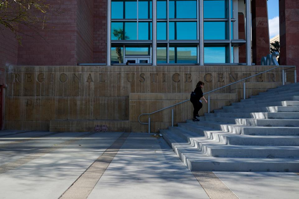 Someone walking up the steps outside the Regional Justice Center in Nevada.