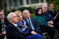 NIH National Institute of Allergy and Infectious Diseases Director Anthony Fauci listens as U.S. President Donald Trump speaks during a news conference in the Rose Garden of the White House