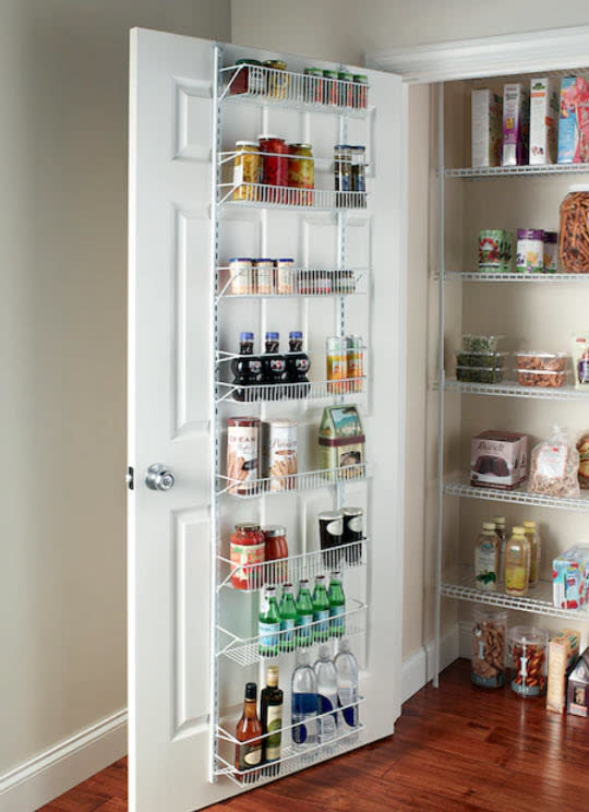 white metal basket holder behind pantry door