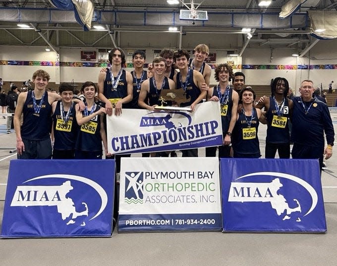 Athletes and coaches from the Littleton boys' indoor track team celebrate the Division 5 state title on Thursday at the Reggie Lewis Center in Boston.