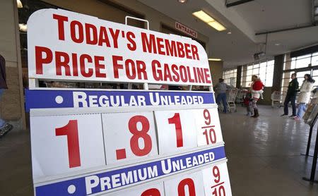 The price sign outside Costco in Westminster, Colorado, shows gas selling for $1.81.9 for the first time in years, December 23, 2014. REUTERS/Rick Wilking