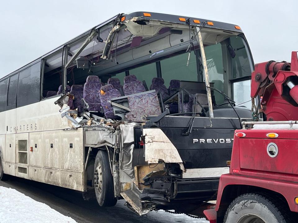 A bus carrying workers from the Come By Chance refinery and a fuel truck collided Monday morning, spilling thousands of litres of fuel and sending multiple people to the hospital. (Terry Roberts/CBC - image credit)