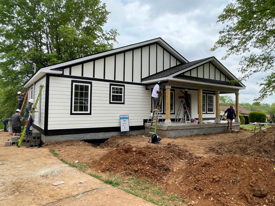 First Farmers of Columbia and Habitat for Humanity Williamson-Maury partner to put the finishing touches on the new home of Columbia-native Shirley Wilson and her granddaughter Demiria.