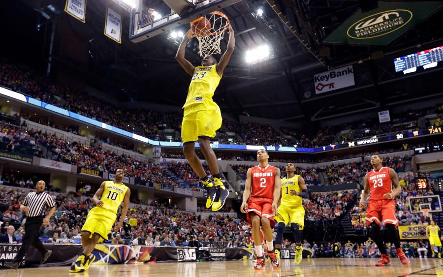 Michigan guard Caris LeVert dunks in the first half of an NCAA college basketball game against Ohio State in the semifinals of the Big Ten Conference tournament Saturday, March 15, 2014, in Indianapolis. (AP Photo/Michael Conroy)