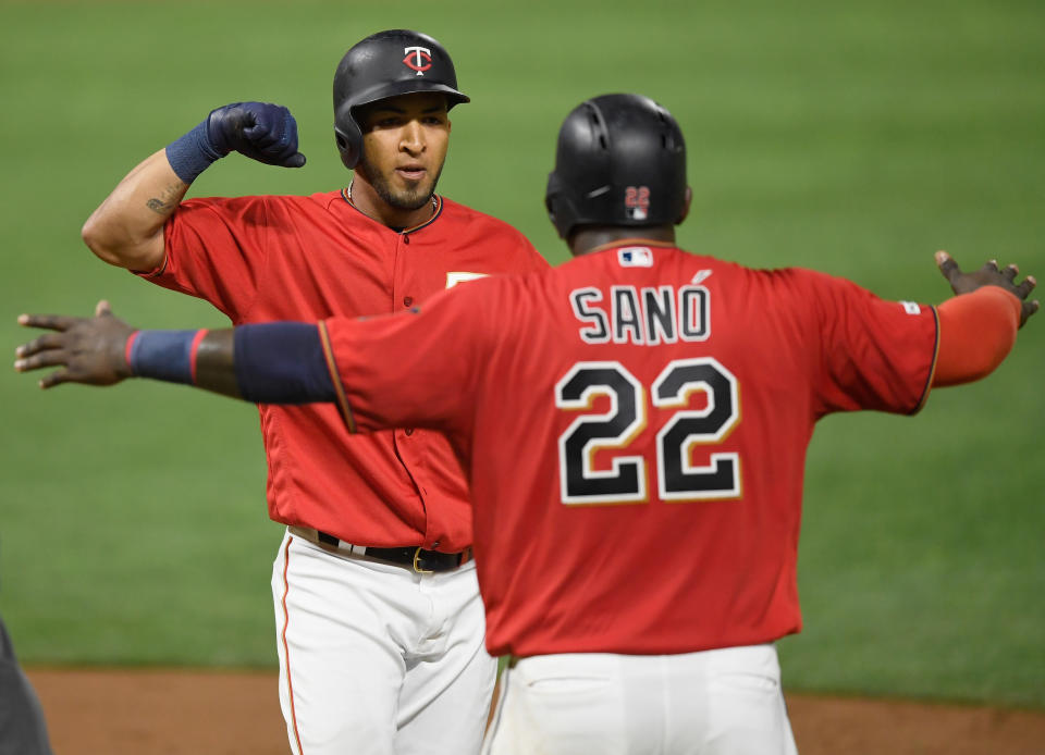 Miguel Sano of the Minnesota Twins congratulates teammate Eddie Rosario