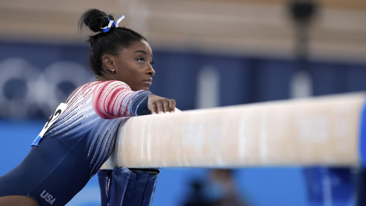 Simone Biles, of the United States, preparers to perform on the balance beam during the artistic gymnastics women's apparatus final at the 2020 Summer Olympics, Tuesday, Aug. 3, 2021, in Tokyo, Japan. (AP Photo/Natacha Pisarenko)