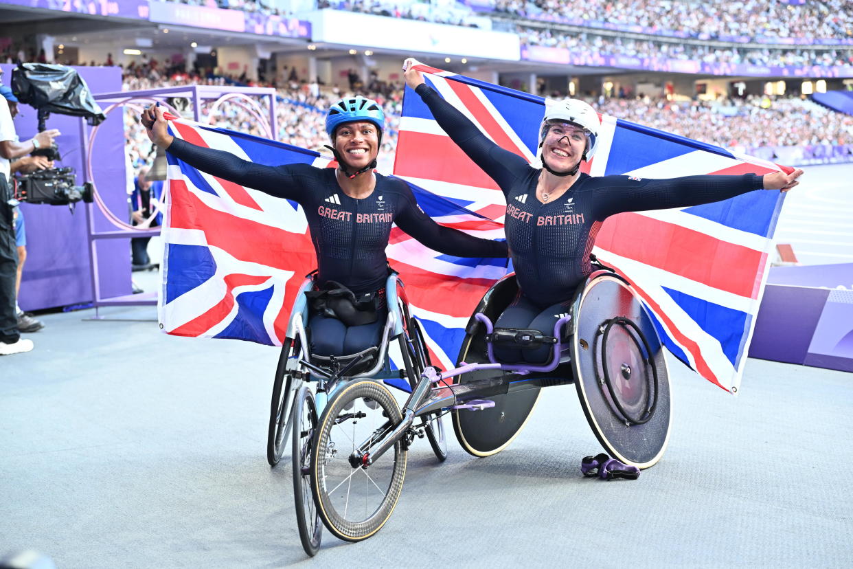 PARIS, FRANCE - SEPTEMBER 01: Hannah Cockroft (R) of Great Britain secures the first place in Para Athletics Women's 100m - T34 Round 1 at the Paris 2024 Olympics, celebrates with Kare Adenegan (L) of Great Britain in France on September 1, 2024. (Photo by Mustafa Yalcin/Anadolu via Getty Images)