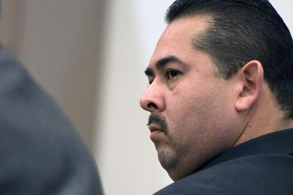 Former Fullerton police officer Manuel Ramos listens to closing arguments at his trial in Santa Ana